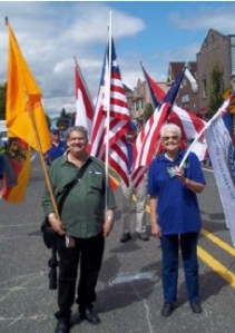Patrick Genna and Vera Robbins march with Michael Orelove (not pictured) and the Kiwanis in the Troutdale Summer Fest Parade.