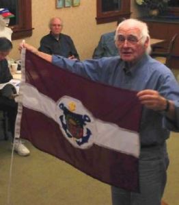 Sam Oakland shares one of his many newly-acquired flags: the Latvian Sailing Association burgee.