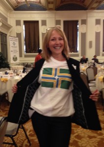 Portland City Club member and sound technician sports the flag T-shirt in the Sentinel Hotel ballroom.