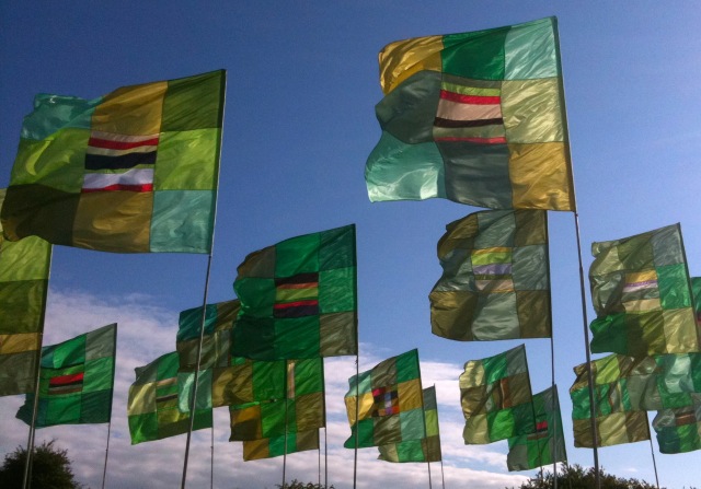 “I really like the music of James Brown. It has so many different facets, it is so sophisticated. And it’s the same with flags — they work on you in a mysterious way."  Flags at the Gastonbury festival, from anguswatt.net