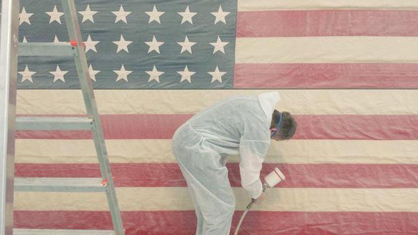 Production of a white flag. From the artist's twitter feed.