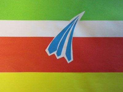 "Here is our flag design from Mary Swanwick Primary School representing Chesterfield, Derbyshire. This was designed and made by children in Year 5 and 6. YELLOW – represents the abundance of rape seed crops in the fields around Chesterfield. RED – represents the town and its buildings. WHITE – signifies the regeneration of Chesterfield Canal. GREEN – because our town is famously referred to as the ‘Gateway to the Peaks’. The centre emblem is the Crooked Spire of which Chesterfield is most famous." (Link to entry.)