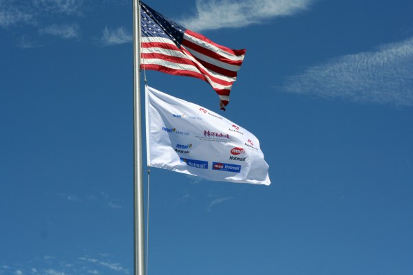 Hotmail flag.  A flag with all the Hotmail logos from the last 10 years flies one last time. Photo by Nial Kennedy, taken 14 July 2006, posted on Flickr.