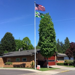 The US and Portland flags fly above Portland Fire & Rescue Station 5.  Photo by Scott Mainwaring.