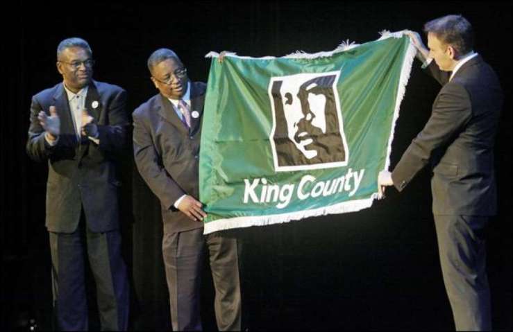 ty_Councilman_Larry_Gossett__and_King_County_Chair__Dow_Constantine_Unveil_the_New_County_Flag__January_2009__Seattle_Times__1
